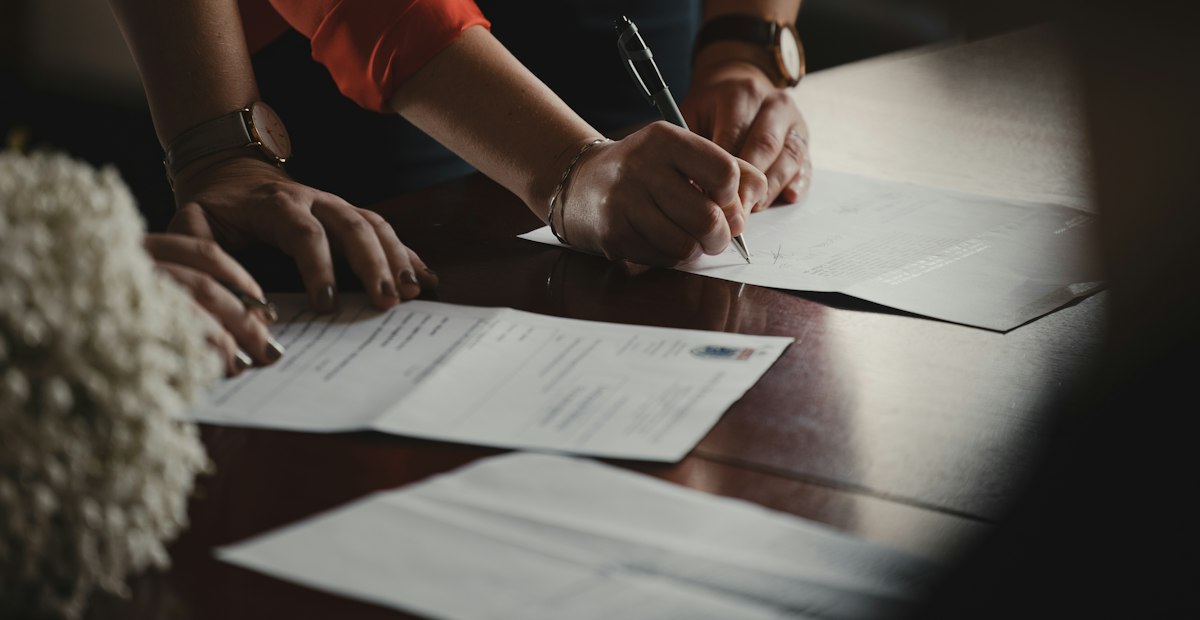 Writing on paper at a desk